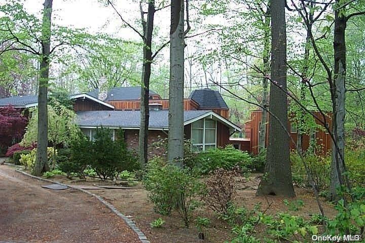 933 Middle Neck Road Great Neck, NY 11024 - Photo 1 of 1 a view of a house with large trees
