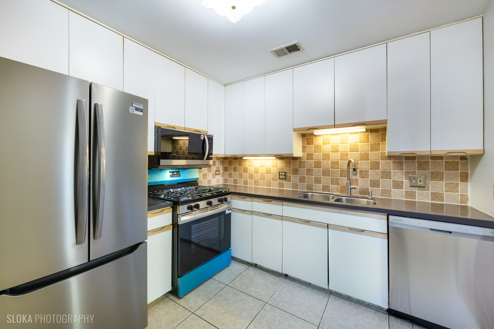 2342 Hamilton Place Schaumburg, IL 60107 - Photo 22 of 25 a kitchen with granite countertop stainless steel appliances a sink and cabinets