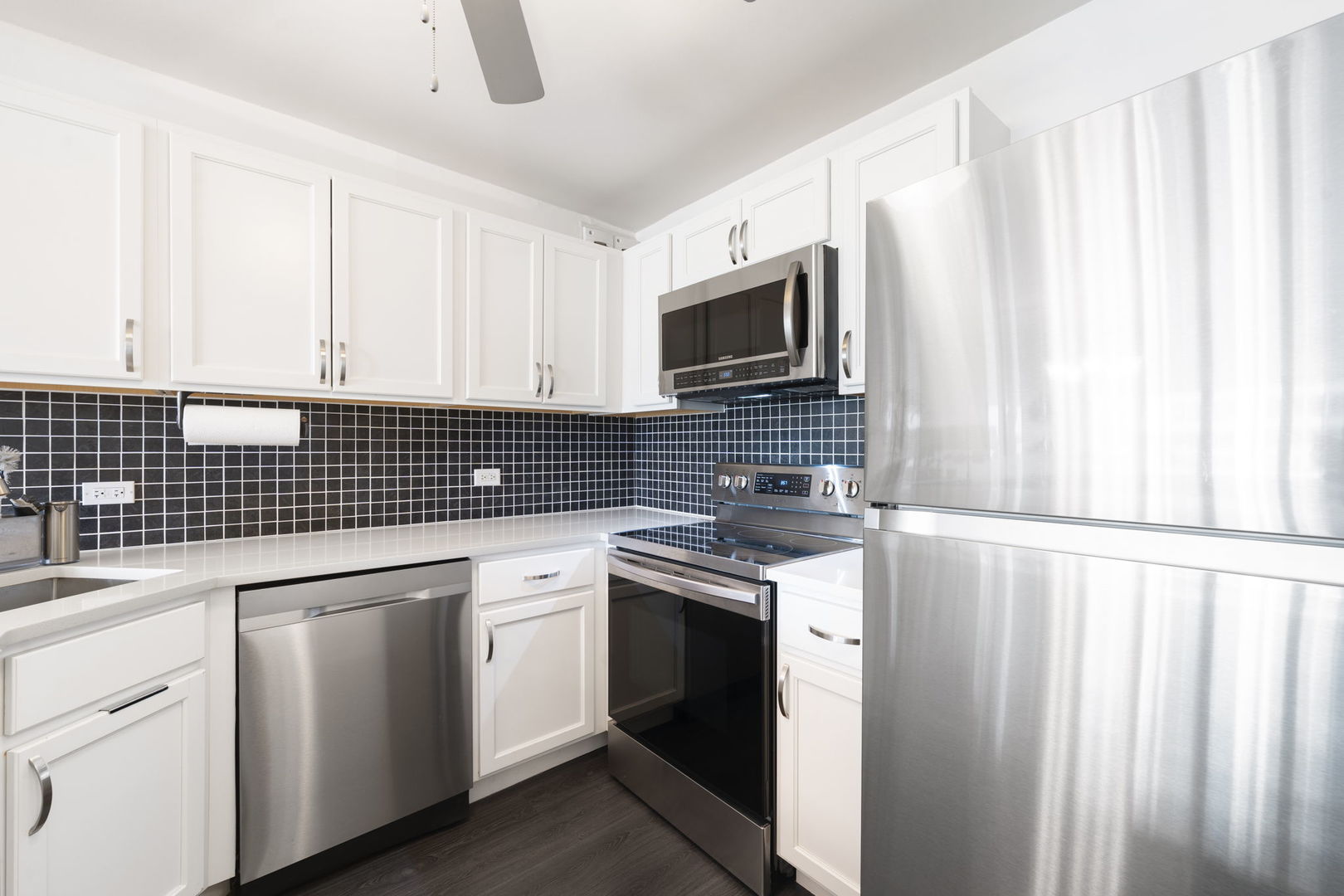 525 West Hawthorne Place, Unit 2606 Chicago, IL 60657 - Photo 11 of 37 a kitchen with a sink stove and cabinets