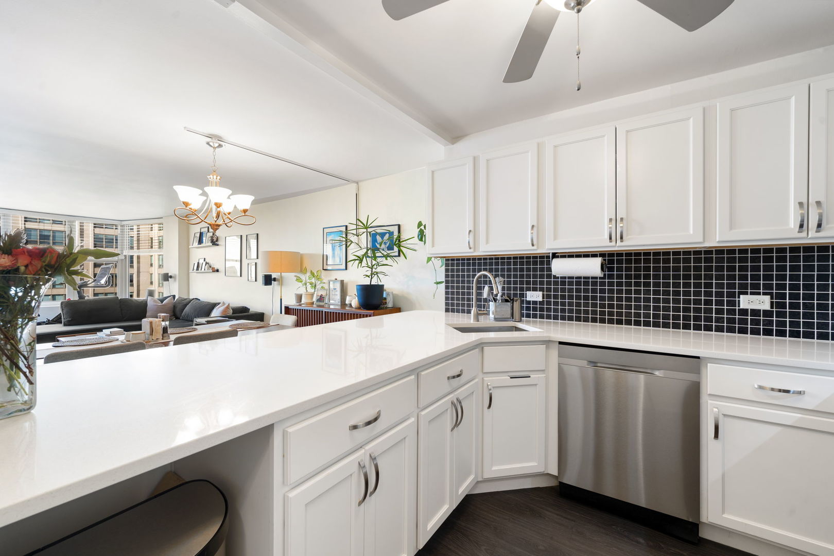 525 West Hawthorne Place, Unit 2606 Chicago, IL 60657 - Photo 12 of 37 a kitchen with white cabinets sink and white appliances