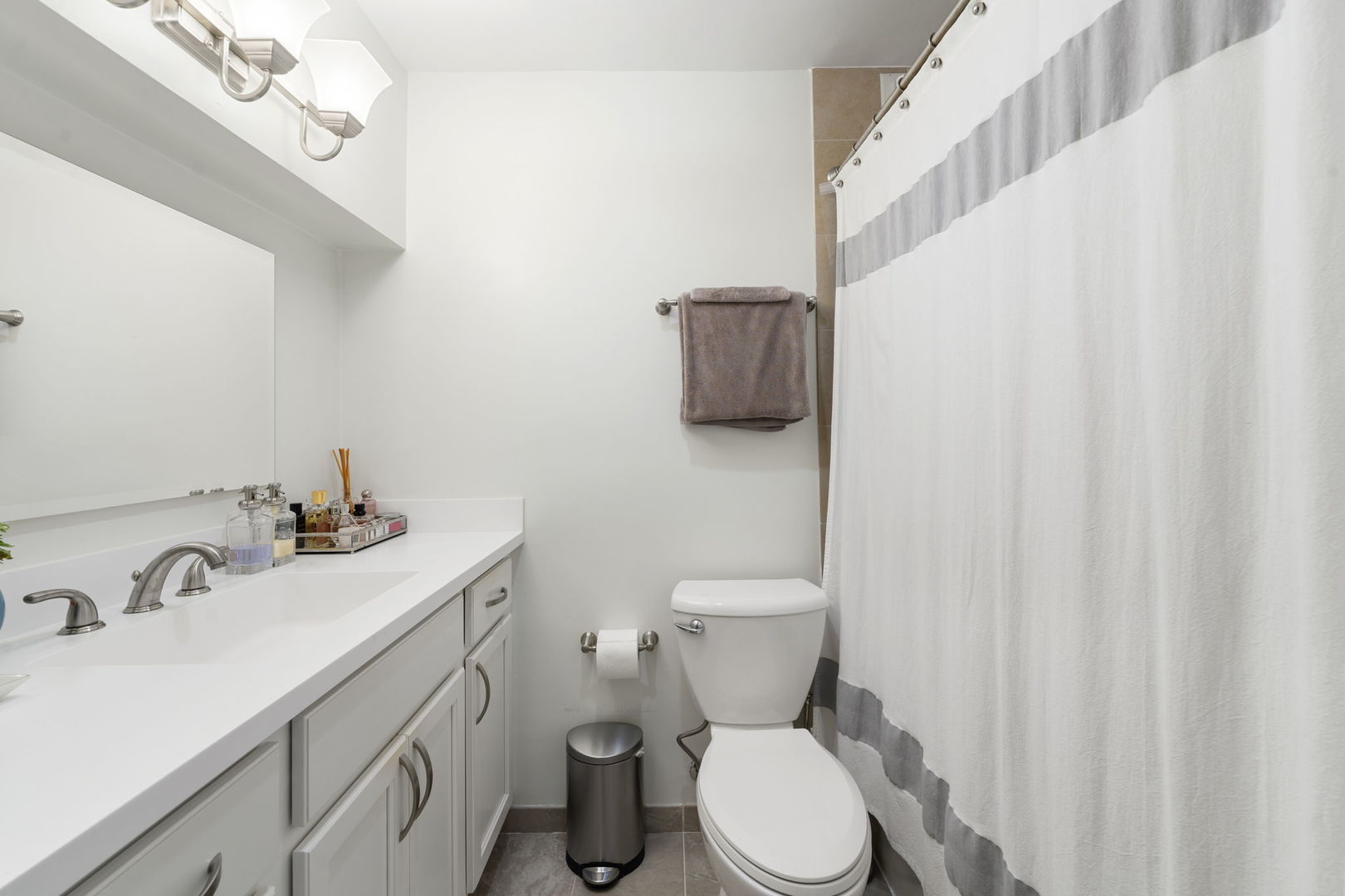 525 West Hawthorne Place, Unit 2606 Chicago, IL 60657 - Photo 16 of 37 a bathroom with a sink a toilet and mirror
