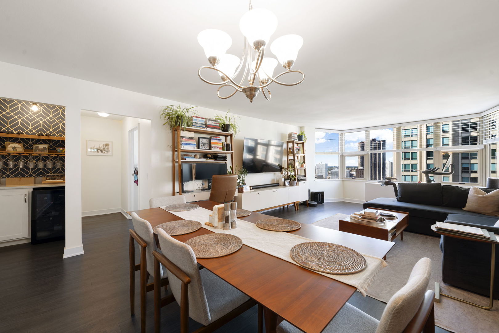 525 West Hawthorne Place, Unit 2606 Chicago, IL 60657 - Photo 7 of 37 a view of a dining room with furniture and wooden floor