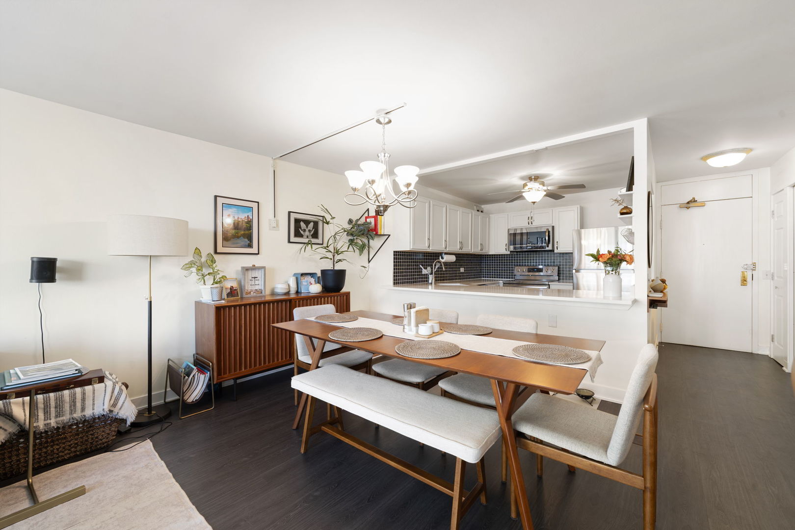 525 West Hawthorne Place, Unit 2606 Chicago, IL 60657 - Photo 8 of 37 a living room with stainless steel appliances kitchen island granite countertop furniture and a view of kitchen