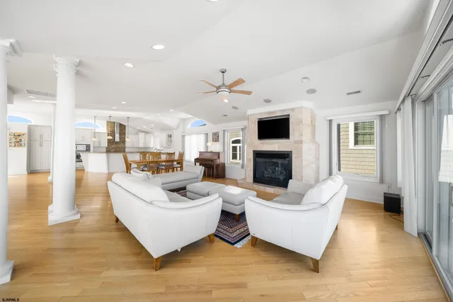 a living room with furniture fireplace and a television