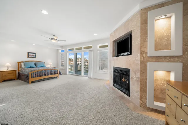 a view of livingroom with furniture fireplace and window