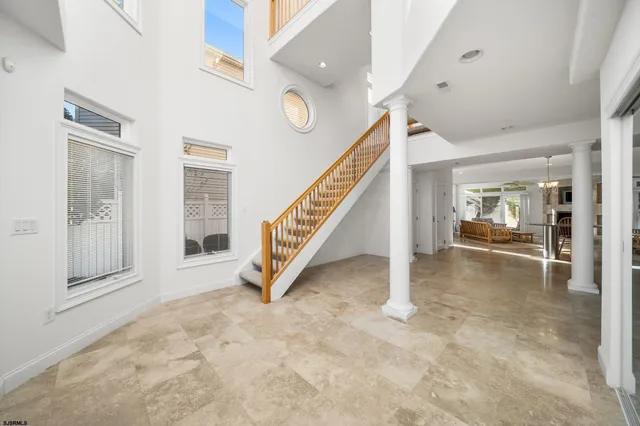 a view of an entryway with wooden floor