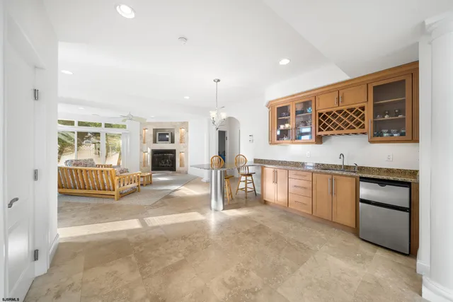 a view of a kitchen with a sink and cabinets