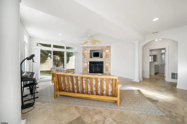 a bed room with furniture and a fireplace