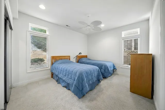 a bathroom with a double vanity sink and mirror