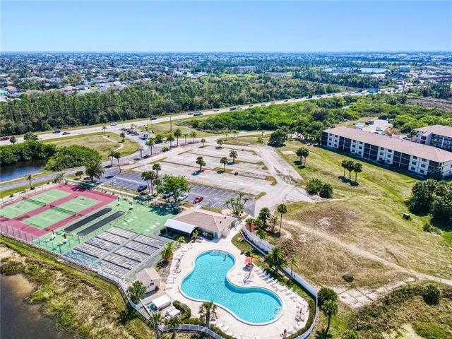 an aerial view of a pool patio patio and outdoor seating