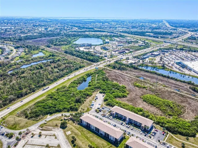 a view of a lake with a house in the background