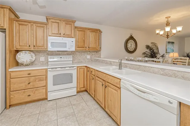 a kitchen with cabinets and window