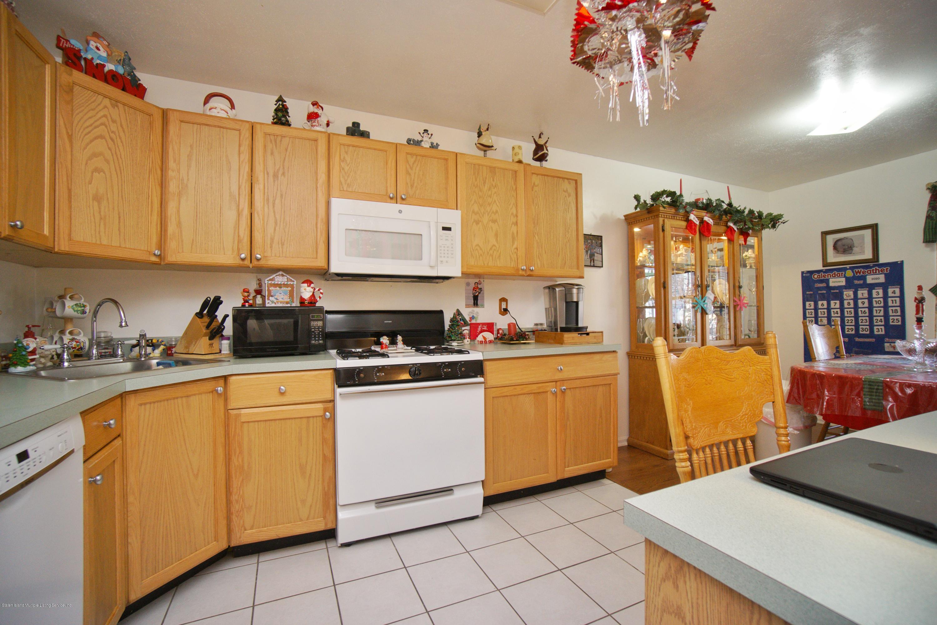 1316 Arthur Kill Road Staten Island, NY 10312 - Photo 9 of 19 kitchen facing dining area
