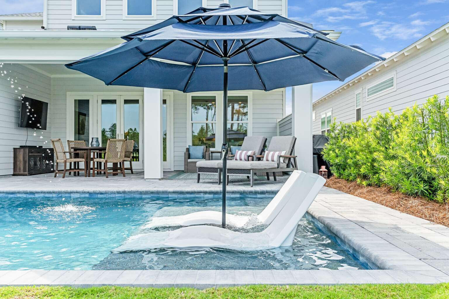 1760 Pathways Dr Inlet Beach Inlet Beach, FL 32461 - Photo 2 of 36 a patio with a patio table and chairs
