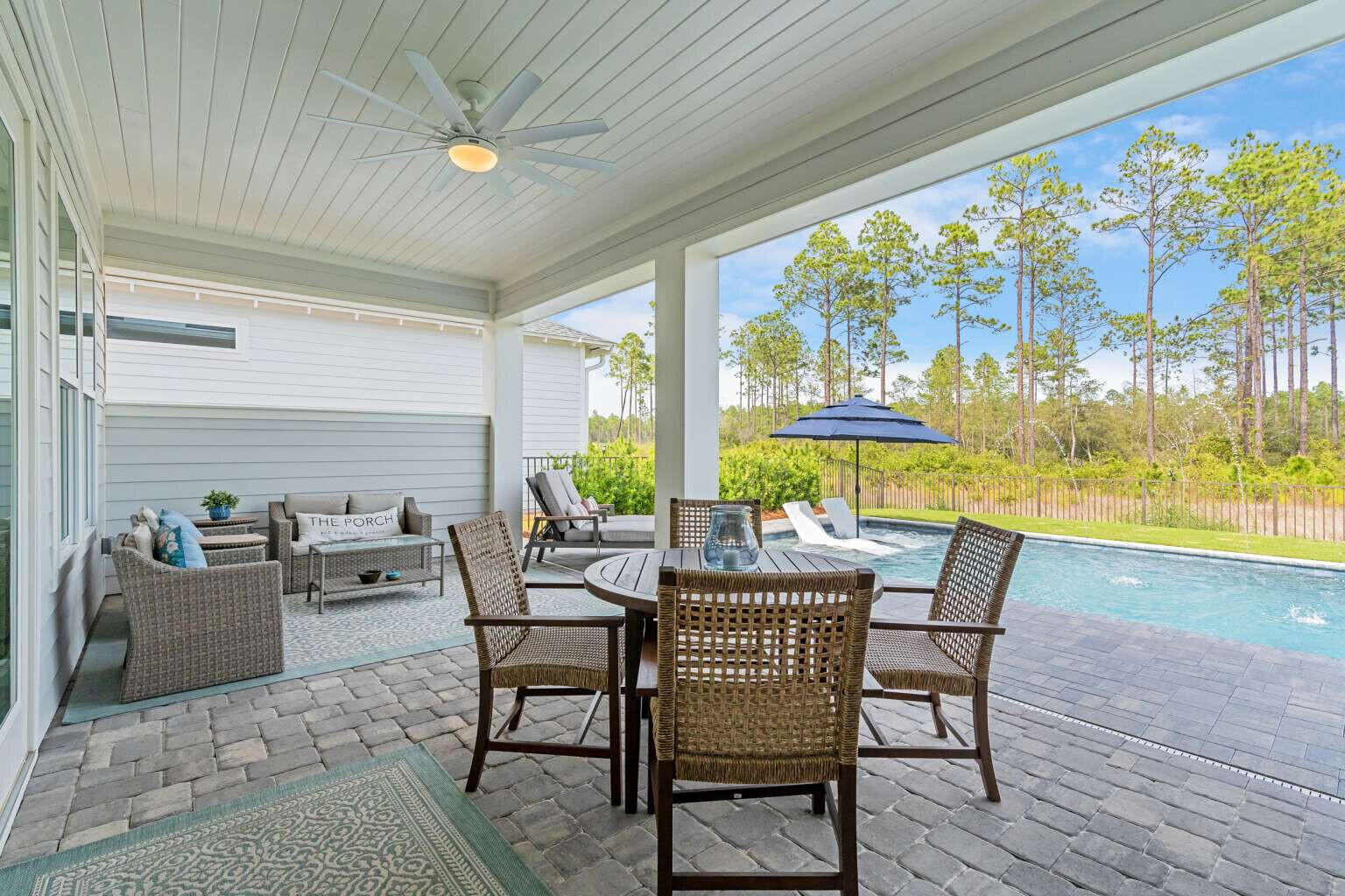 1760 Pathways Dr Inlet Beach Inlet Beach, FL 32461 - Photo 33 of 36 a view of a dining room with furniture large windows and wooden floor