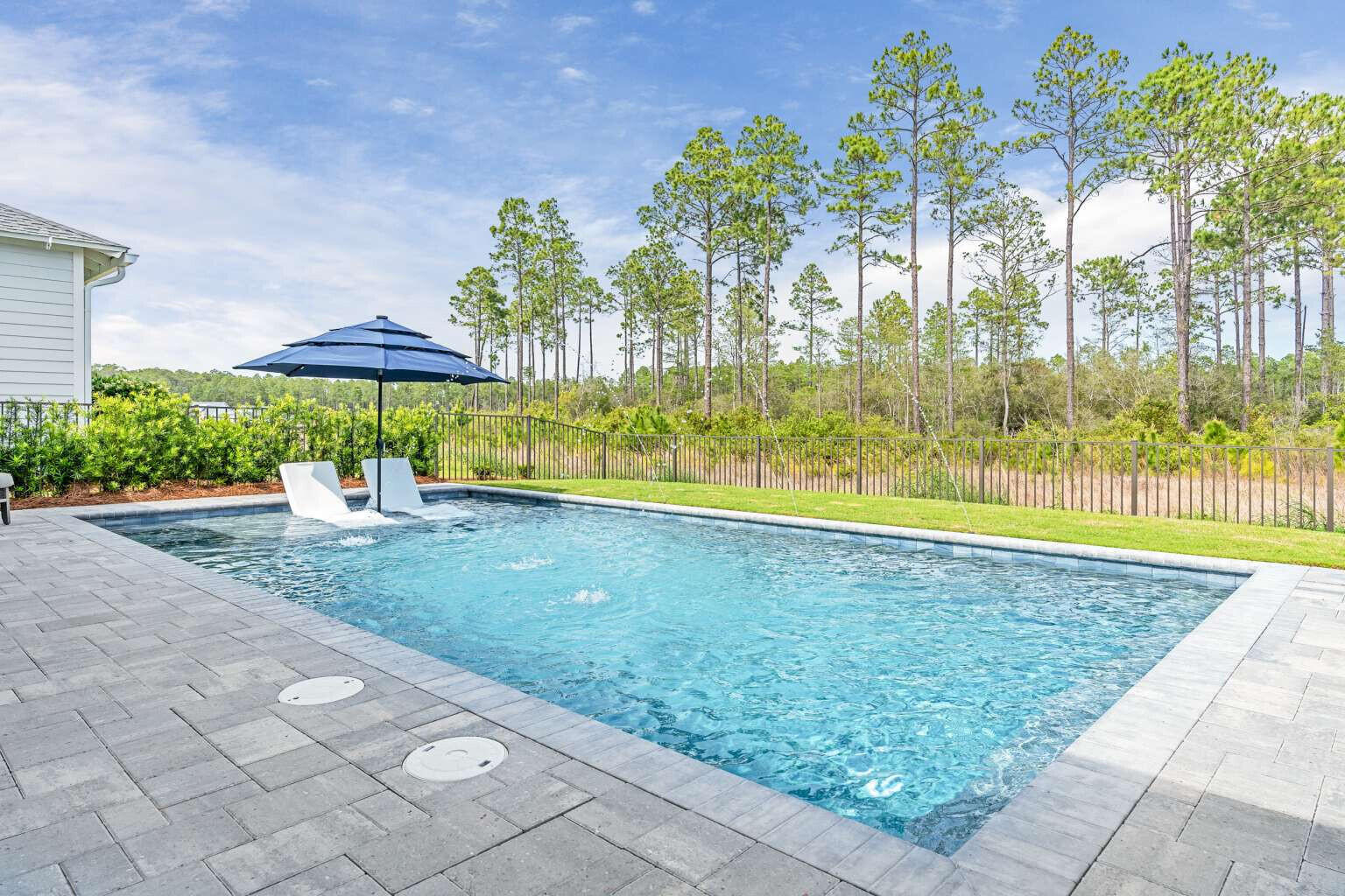 1760 Pathways Dr Inlet Beach Inlet Beach, FL 32461 - Photo 35 of 36 a view of a swimming pool with an outdoor space and seating area