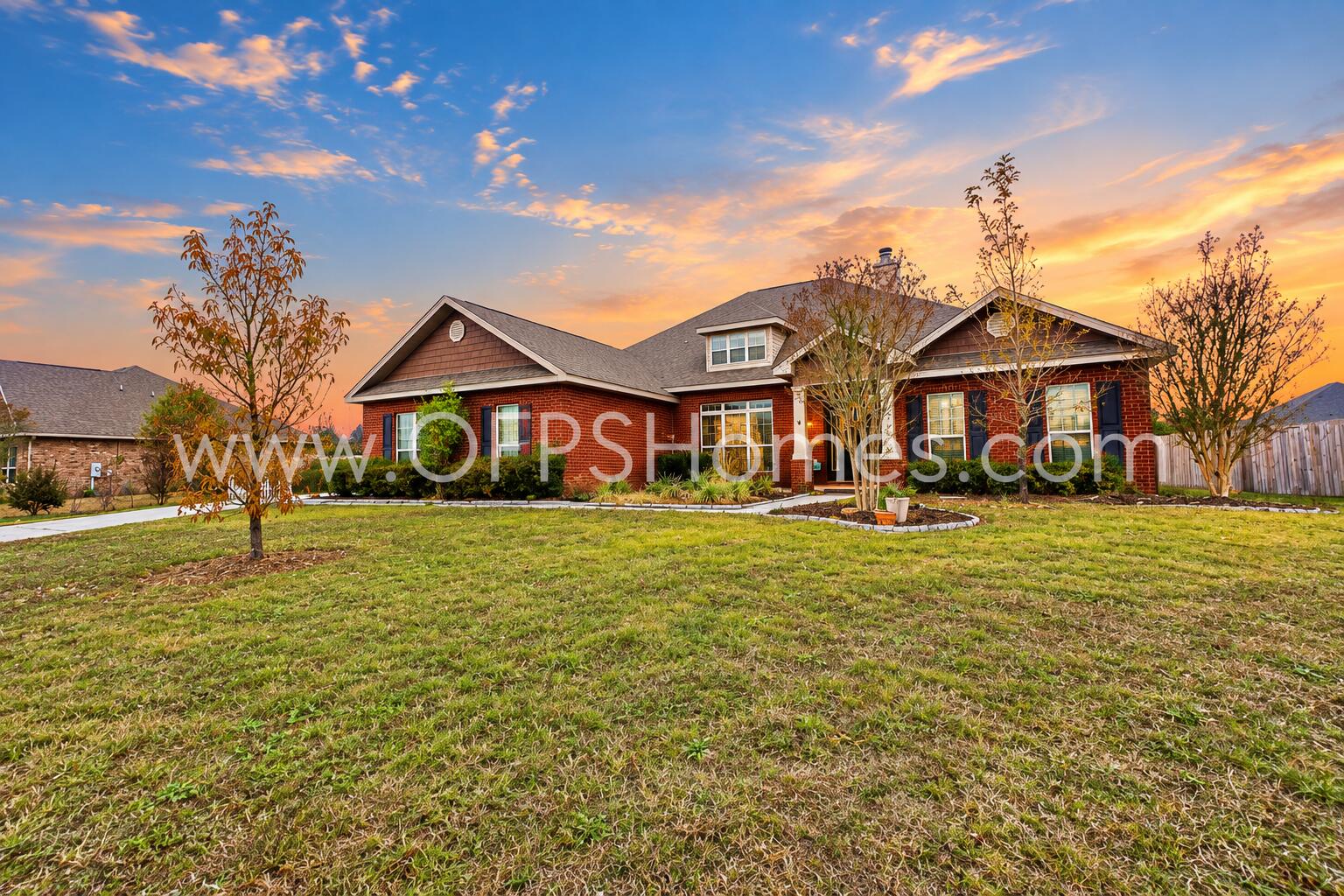 3445 Brownstone Road Crestview, FL 32539 - Photo 2 of 21 Sunset Glow Over a Brick Ranch Home