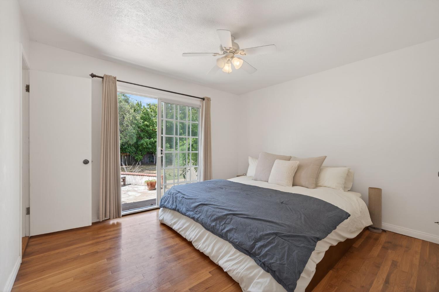 1977 South Rice Road Ojai, CA 93023 - Photo 11 of 27 a bedroom with a large bed and a large window