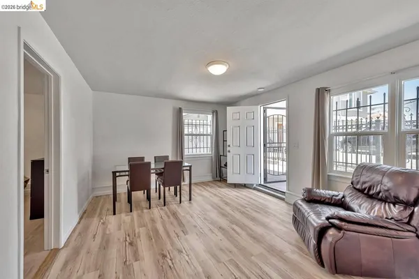 a living room with furniture and large windows