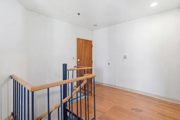a bath room with a sink a toilet and a mirror