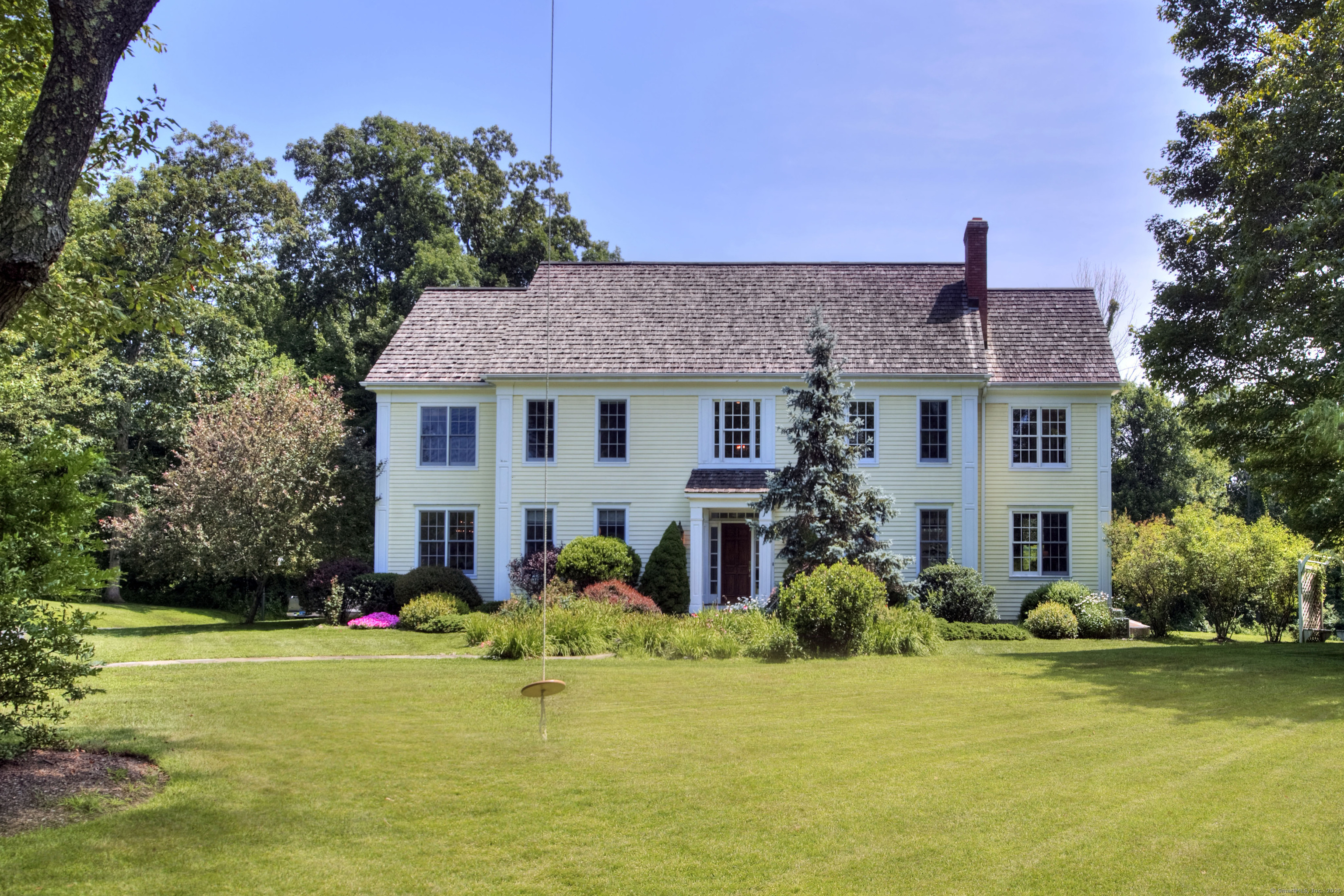 9 Long Meadow Lane Redding, CT 06896 - Photo 1 of 1 a front view of house with yard and green space