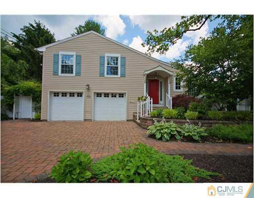 158 Valley Road Princeton, NJ 08540 - Photo 1 of 25 a front view of a house with a yard and garage