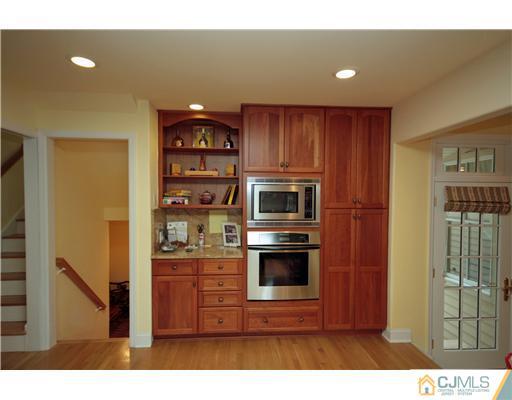 158 Valley Road Princeton, NJ 08540 - Photo 13 of 25 a kitchen with kitchen island a sink stainless steel appliances and cabinets