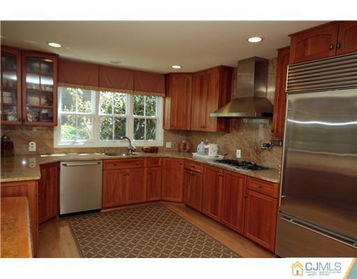 158 Valley Road Princeton, NJ 08540 - Photo 14 of 25 a kitchen with a sink window and cabinets