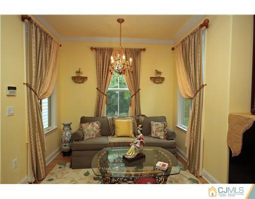 158 Valley Road Princeton, NJ 08540 - Photo 17 of 25 a living room with furniture and a chandelier