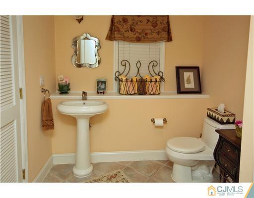 158 Valley Road Princeton, NJ 08540 - Photo 21 of 25 a bathroom with a sink toilet and mirror