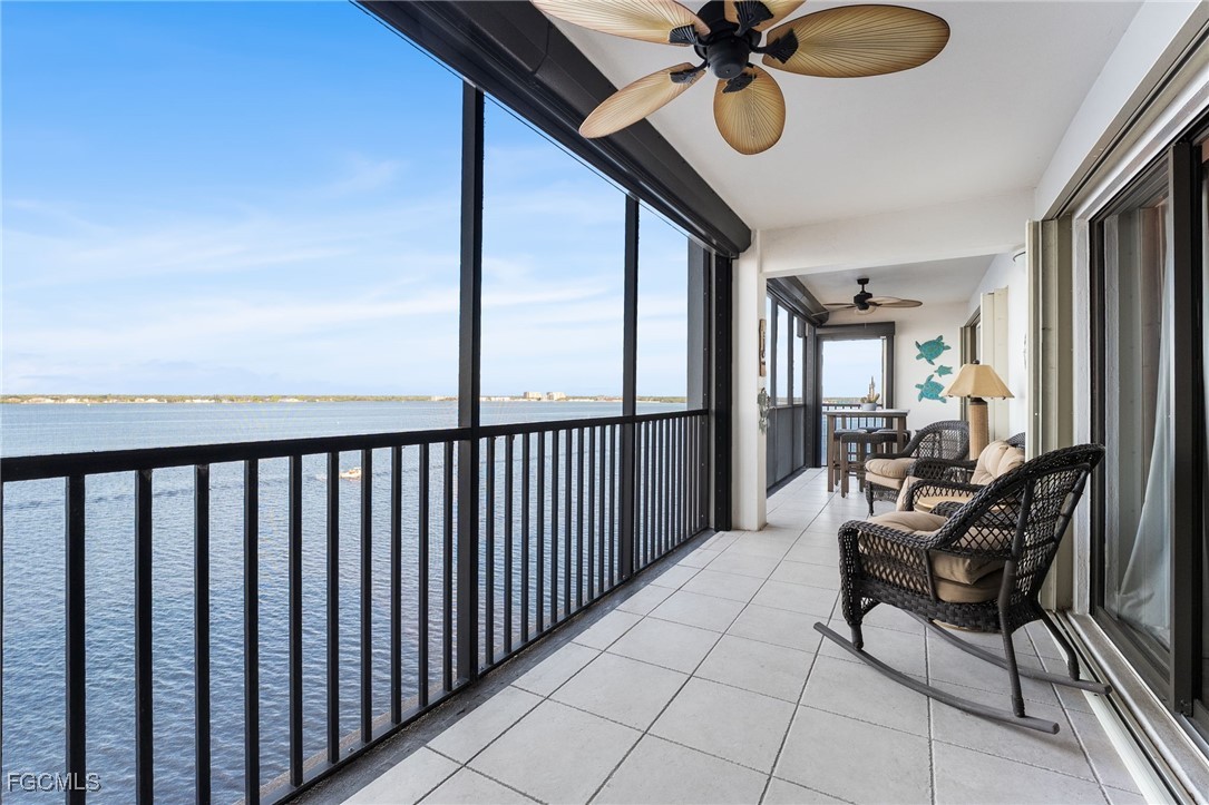 1910 Virginia Avenue, Unit 803 Fort Myers, FL 33901 - Photo 11 of 48 a view of balcony with furniture and floor to ceiling window