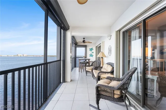a view of a balcony with chairs