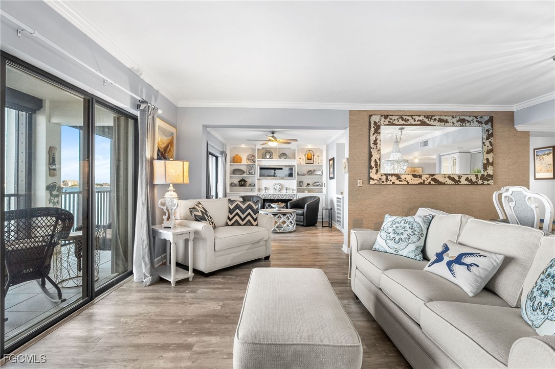 1910 Virginia Avenue, Unit 803 Fort Myers, FL 33901 - Photo 13 of 48 a living room with furniture and a large window