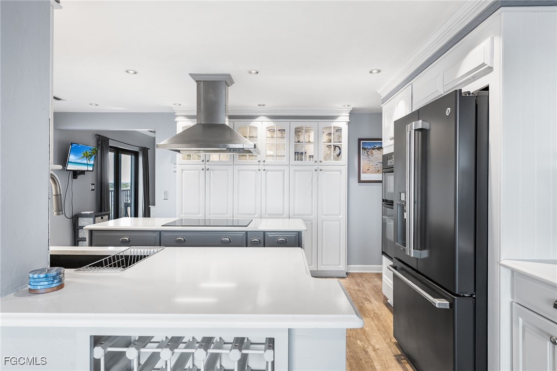 1910 Virginia Avenue, Unit 803 Fort Myers, FL 33901 - Photo 19 of 48 a kitchen with stainless steel appliances granite countertop a refrigerator and a sink