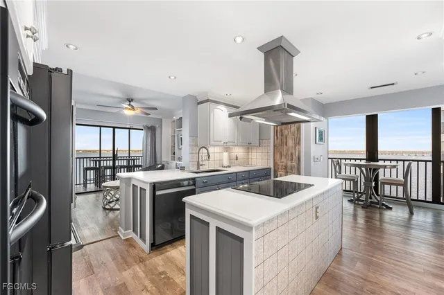 a kitchen with a stove a sink and a refrigerator