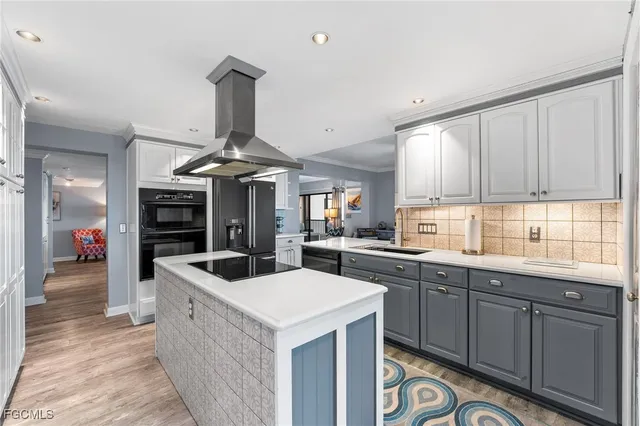 a kitchen with sink and cabinets