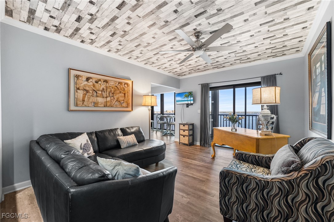 1910 Virginia Avenue, Unit 803 Fort Myers, FL 33901 - Photo 25 of 48 a living room with furniture and a large window
