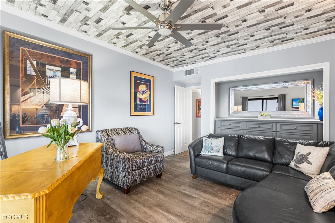 1910 Virginia Avenue, Unit 803 Fort Myers, FL 33901 - Photo 27 of 48 a living room with furniture and a large window