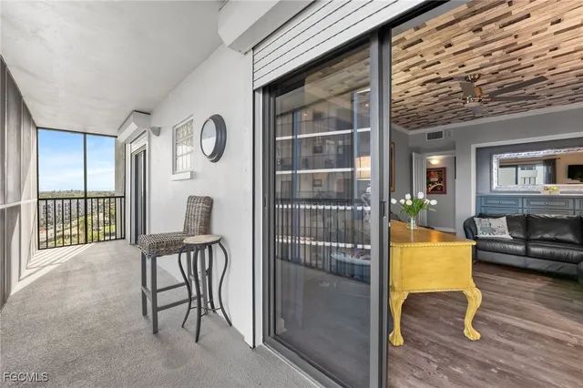 a view of livingroom with furniture and floor to ceiling window