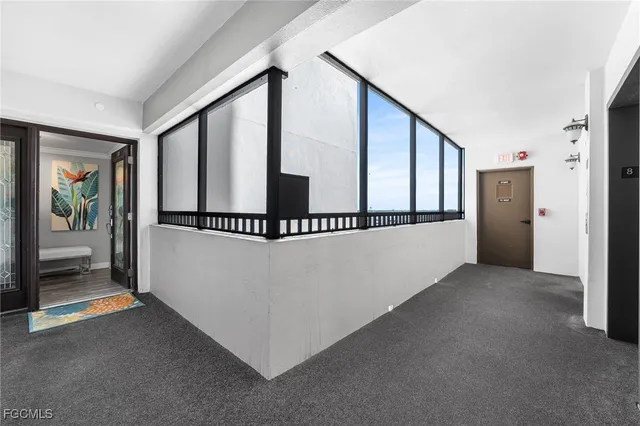 a view of a hallway with staircase