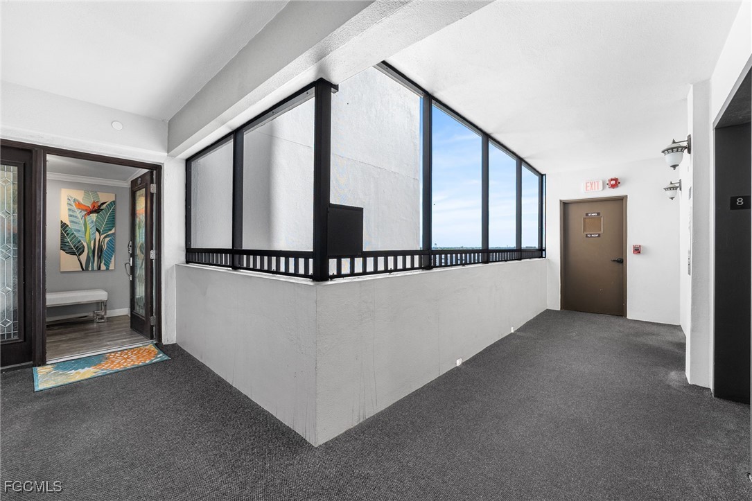 1910 Virginia Avenue, Unit 803 Fort Myers, FL 33901 - Photo 4 of 48 a view of a hallway with staircase
