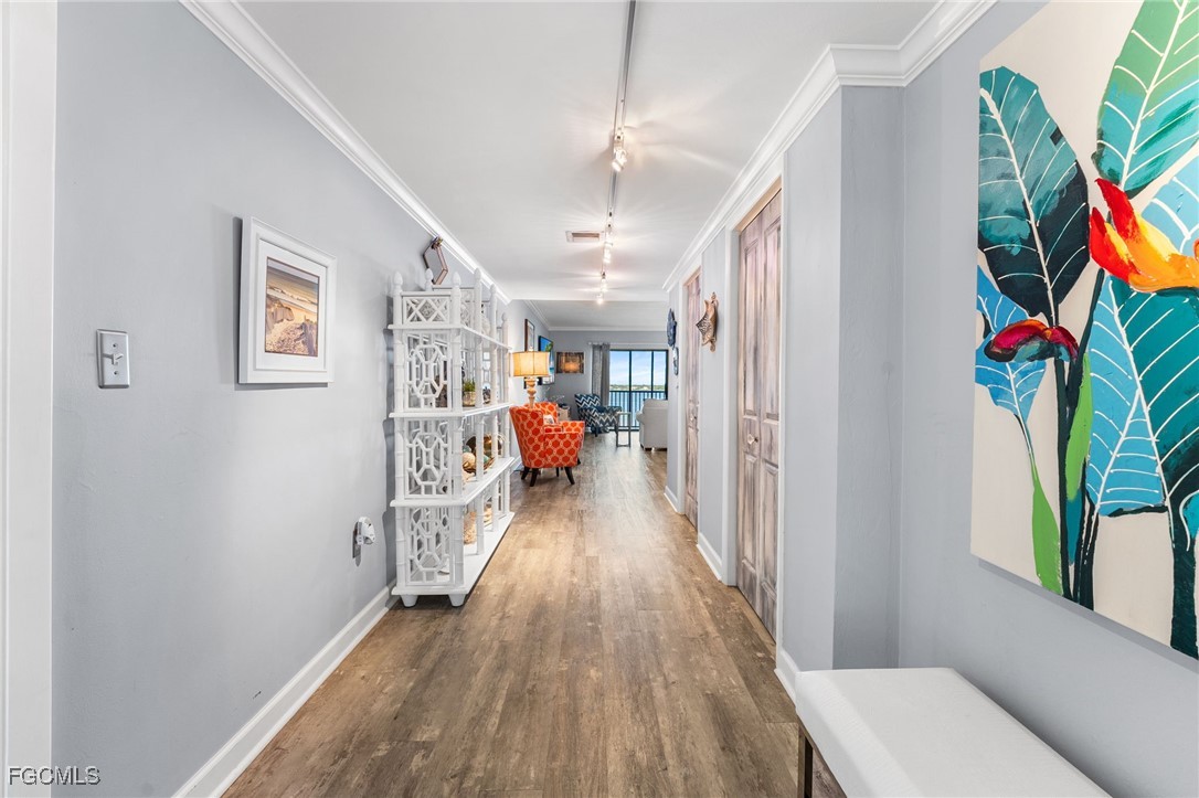 1910 Virginia Avenue, Unit 803 Fort Myers, FL 33901 - Photo 5 of 48 a view of a hallway with workspace and wooden floor