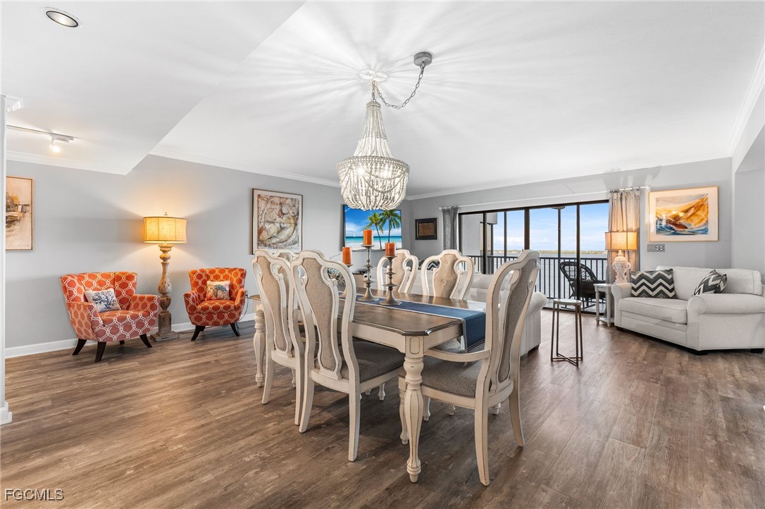 1910 Virginia Avenue, Unit 803 Fort Myers, FL 33901 - Photo 7 of 48 a view of a dining room with furniture window and wooden floor