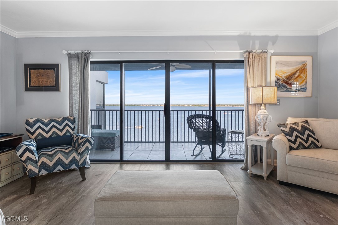 1910 Virginia Avenue, Unit 803 Fort Myers, FL 33901 - Photo 9 of 48 a living room with furniture and a window