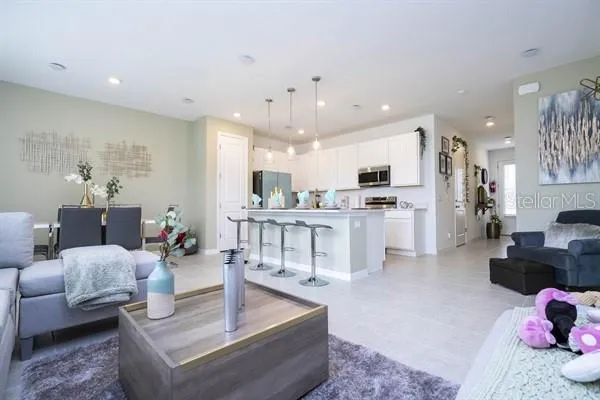 a kitchen with stove and cabinets