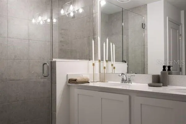 a bedroom with a bed and painting on the wall