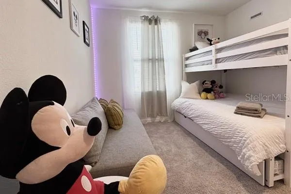 an aerial view of a residential houses with outdoor space and swimming pool