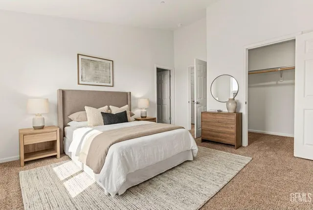 a bed room with a bed and a night stand