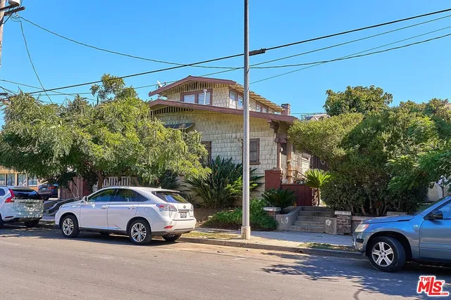 a view of a car parked in front of a house