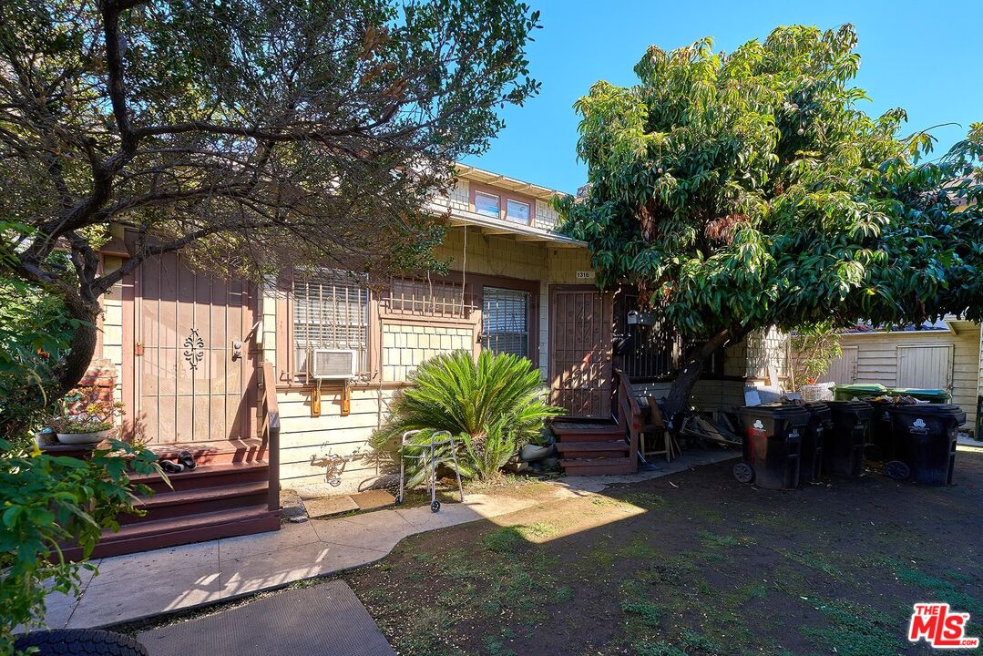 1312 South Ardmore Avenue Los Angeles, CA 90006 - Photo 4 of 7 a view of a porch with furniture and garden